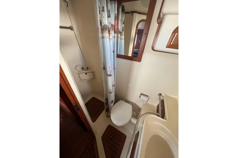 Slide: The Image of Bathroom interior of 2007 Heritage East Sundeck Trawler with shower and toilet. - 15