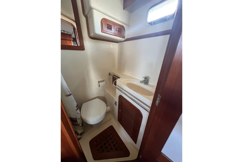 Slide: The Image of Bathroom interior of 2007 Heritage East Sundeck Trawler with sink and toilet. - 16
