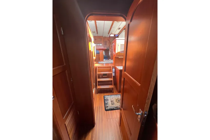 Slide: The Image of Interior view of 2007 Heritage East Sundeck Trawler with wooden finishes and cozy design. - 20