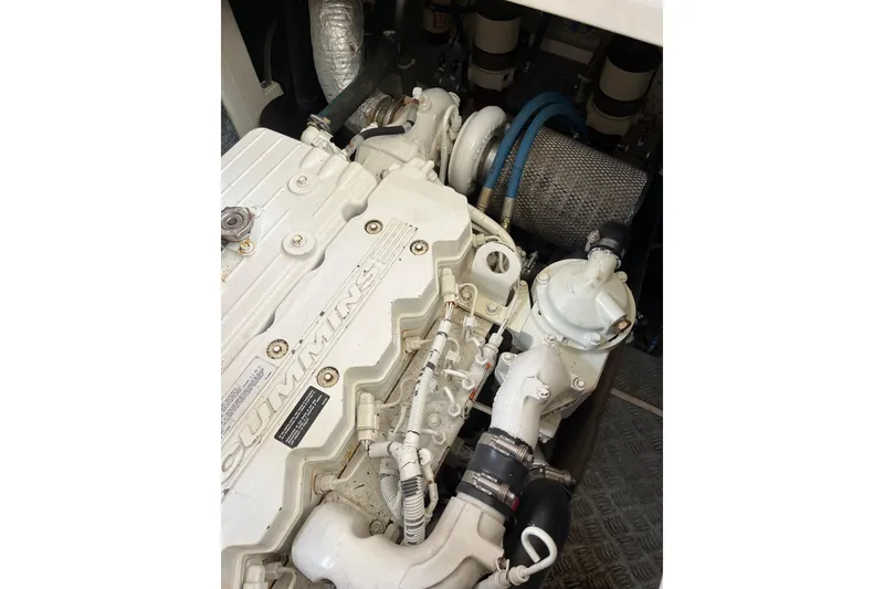 Slide: The Image of Engine compartment of a 2007 Heritage East Sundeck Trawler, featuring a Cummins marine engine. - 39