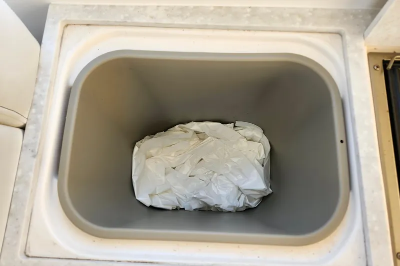 Slide: The Image of Trash bin with crumpled paper inside a 2019 Regal 35 Sport Coupe. - 12