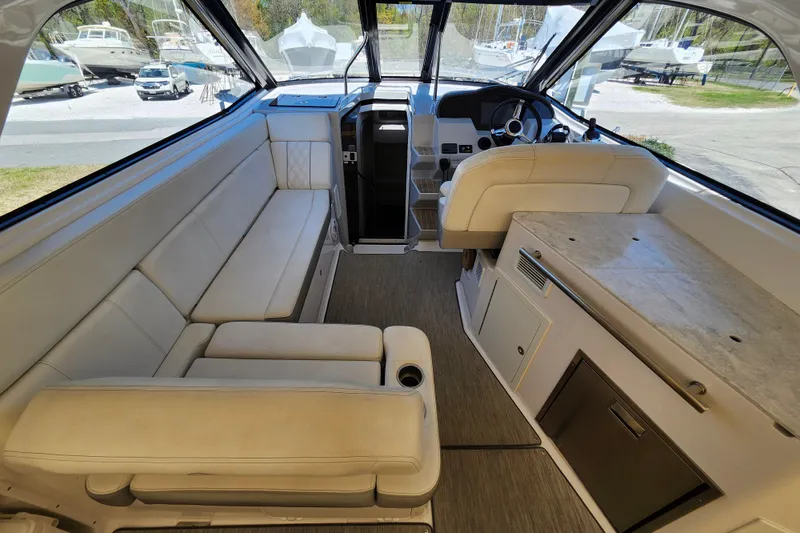 Slide: The Image of Interior of 2019 Regal 35 Sport Coupe with luxurious seating and modern helm. - 14