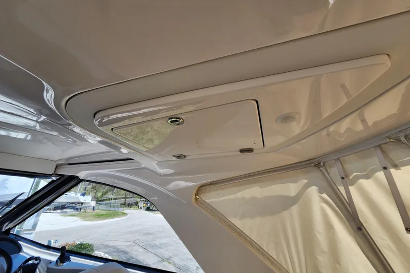 Slide: The Image of 2019 Regal 35 Sport Coupe interior ceiling with hatch and window view. - 15