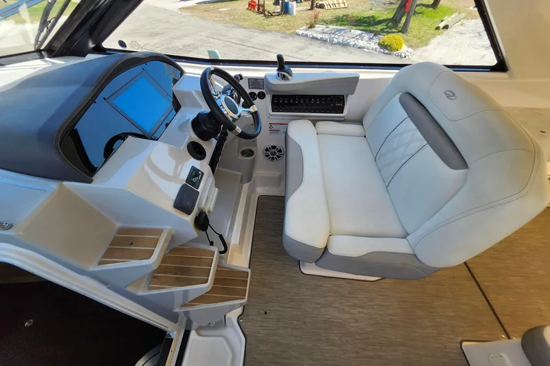 Slide: The Image of 2019 Regal 35 Sport Coupe helm with modern controls and comfortable seating. - 20
