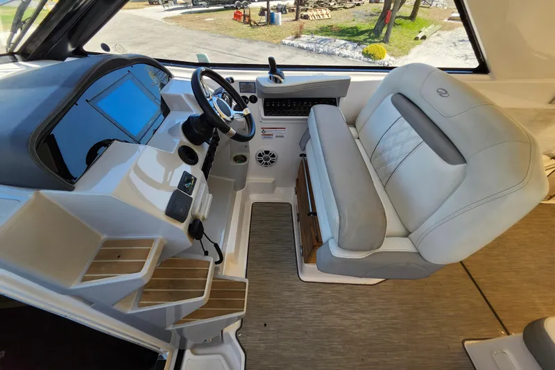 Slide: The Image of 2019 Regal 35 Sport Coupe helm with modern controls and comfortable seating. - 21