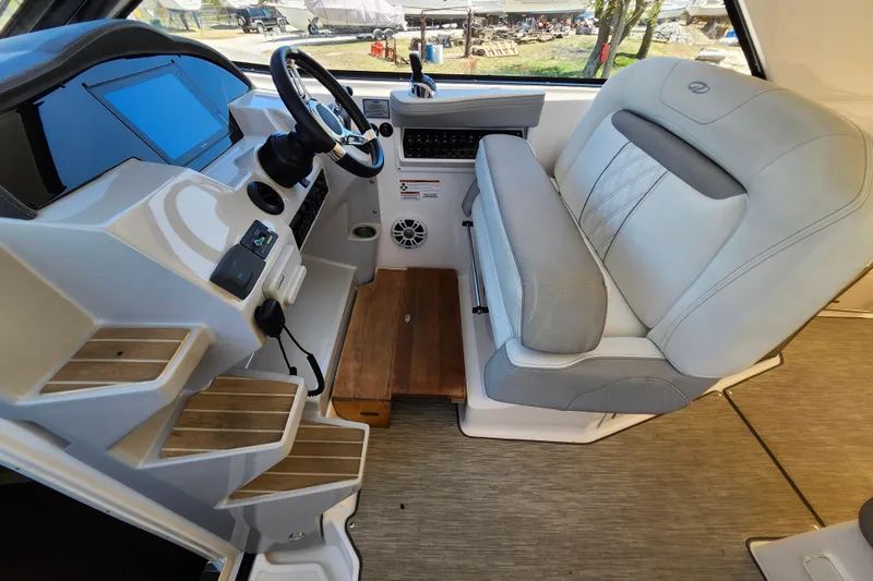 Slide: The Image of 2019 Regal 35 Sport Coupe helm with modern controls and comfortable seating. - 22