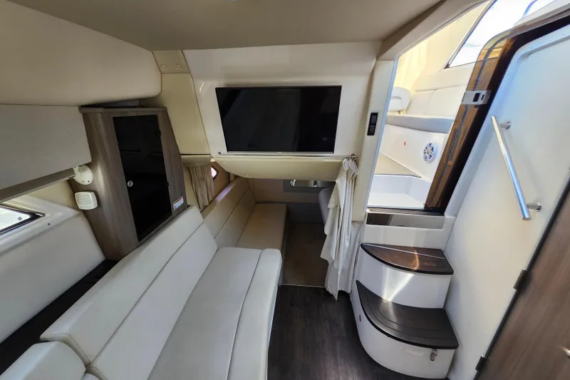 Slide: The Image of Interior of 2019 Regal 35 Sport Coupe with modern seating and entertainment system. - 29