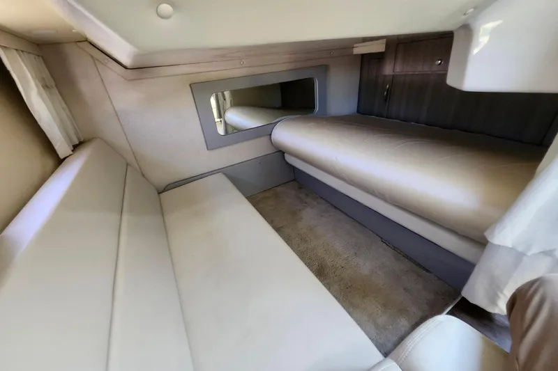 Slide: The Image of 2019 Regal 35 Sport Coupe interior cabin with beige seating and a mirror. - 30