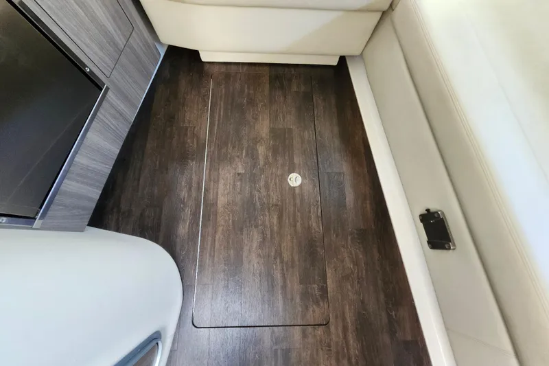 Slide: The Image of Wooden floor panel inside 2019 Regal 35 Sport Coupe boat interior. - 32