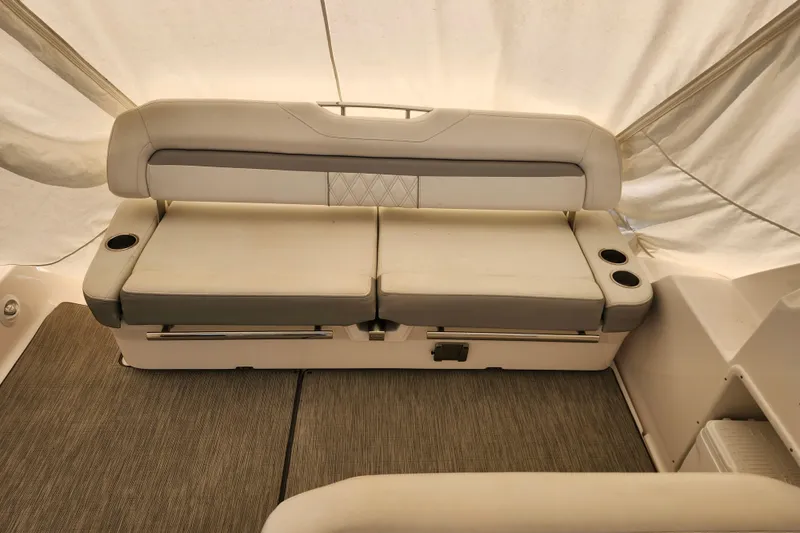 Slide: The Image of 2019 Regal 35 Sport Coupe interior with beige seating and cup holders. - 4