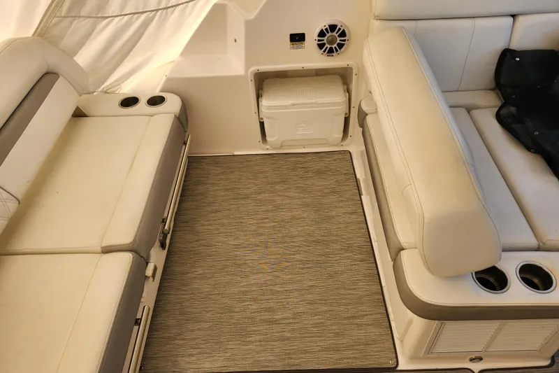 Slide: The Image of Interior of 2019 Regal 35 Sport Coupe with beige seating and cup holders. - 6