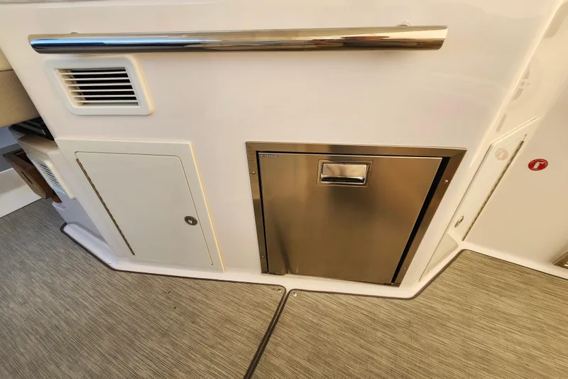 Slide: The Image of 2019 Regal 35 Sport Coupe interior with stainless steel panel and storage compartments. - 9