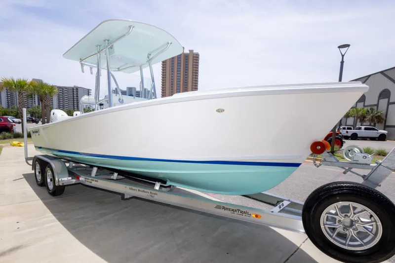 Slide: The Image of 2026 Albury Brothers 23 Forward Seating boat on trailer, urban background. - 15