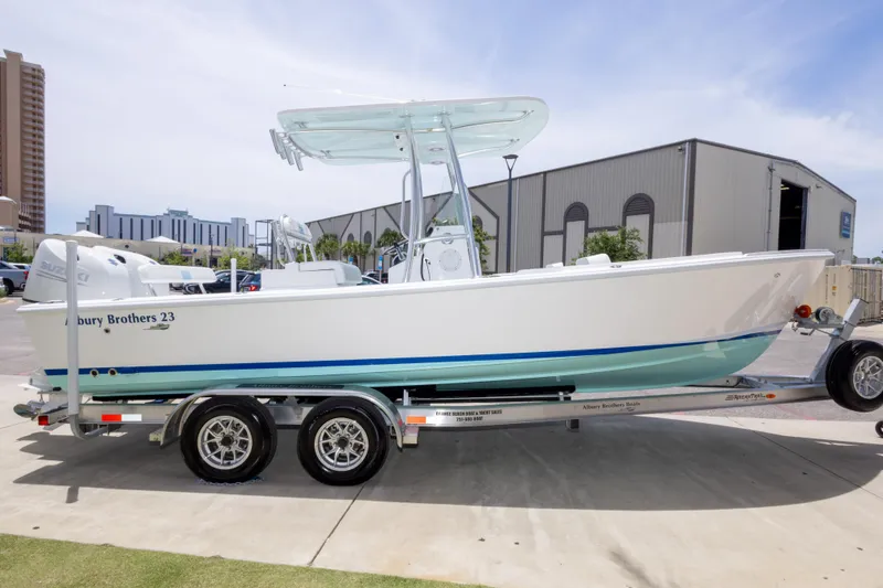 Slide: The Image of 2026 Albury Brothers 23 Forward Seating boat on trailer, parked outdoors. - 16