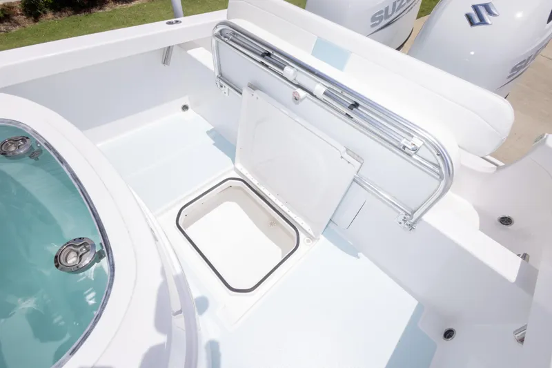 Slide: The Image of 2026 Albury Brothers 23 Forward Seating boat with open storage compartment and Suzuki engines. - 23