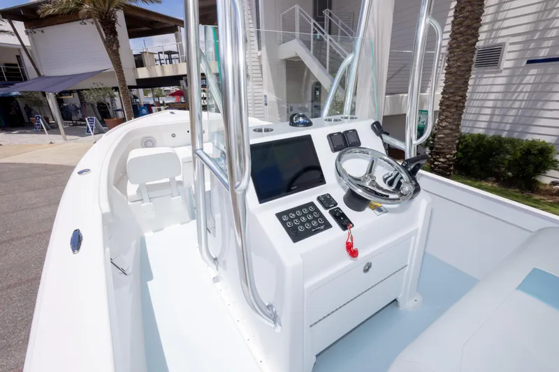 Slide: The Image of 2026 Albury Brothers 23 Forward Seating boat interior with modern console and steering wheel. - 28