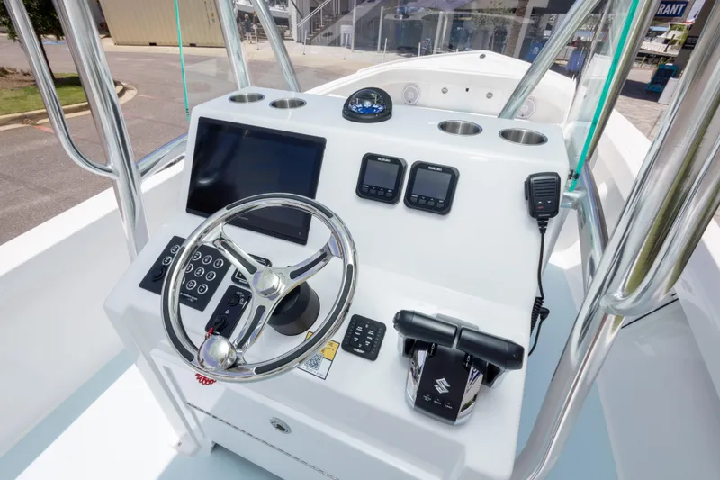 Slide: The Image of 2026 Albury Brothers 23 Forward Seating boat console with steering wheel and navigation controls. - 31