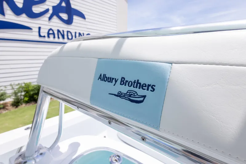 Slide: The Image of 2026 Albury Brothers 23 Forward Seating boat logo on white upholstery. - 37