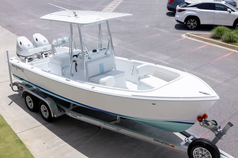 Slide: The Image of 2026 Albury Brothers 23 Forward Seating boat on trailer in parking lot. - 4