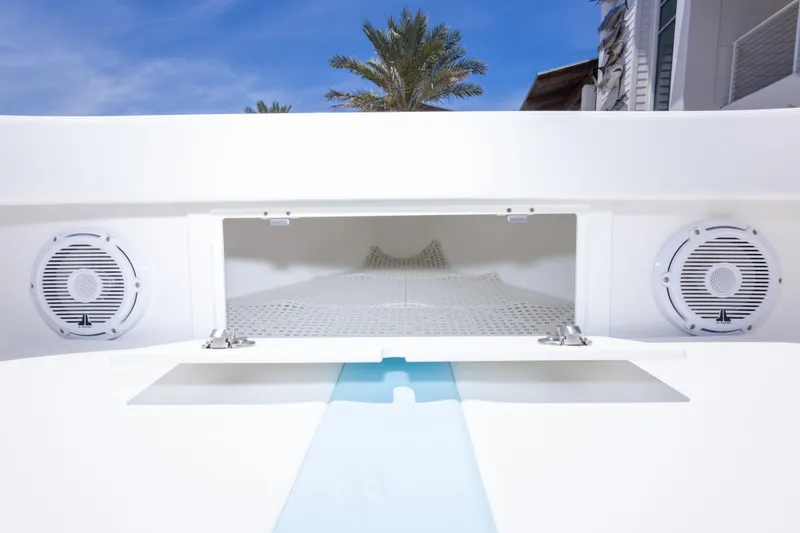 Slide: The Image of 2026 Albury Brothers 23 Forward Seating boat interior with speakers and storage compartment. - 43