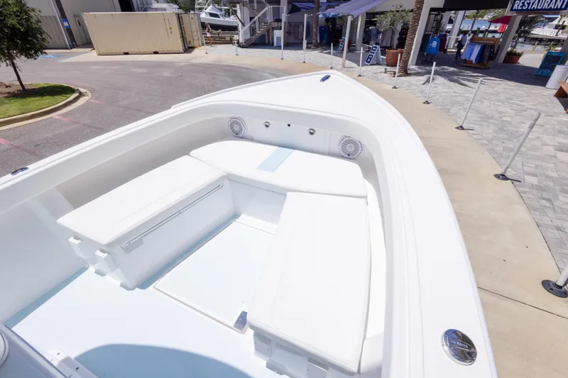 Slide: The Image of 2026 Albury Brothers 23 Forward Seating boat with spacious white interior at a marina. - 46