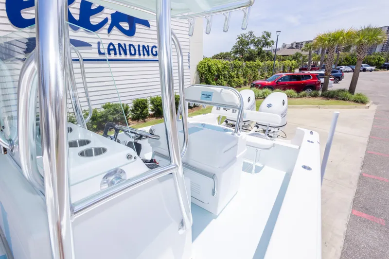 Slide: The Image of 2026 Albury Brothers 23 Forward Seating boat at a marina with palm trees and parked cars. - 47