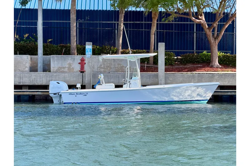 Slide: The Image of 2026 Albury Brothers 23 Forward Seating boat docked by a waterfront. - 54