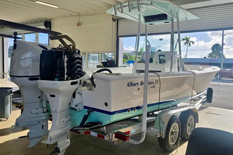 Slide: The Image of 2026 Albury Brothers 23 Forward Seating boat on trailer in a garage. - 55