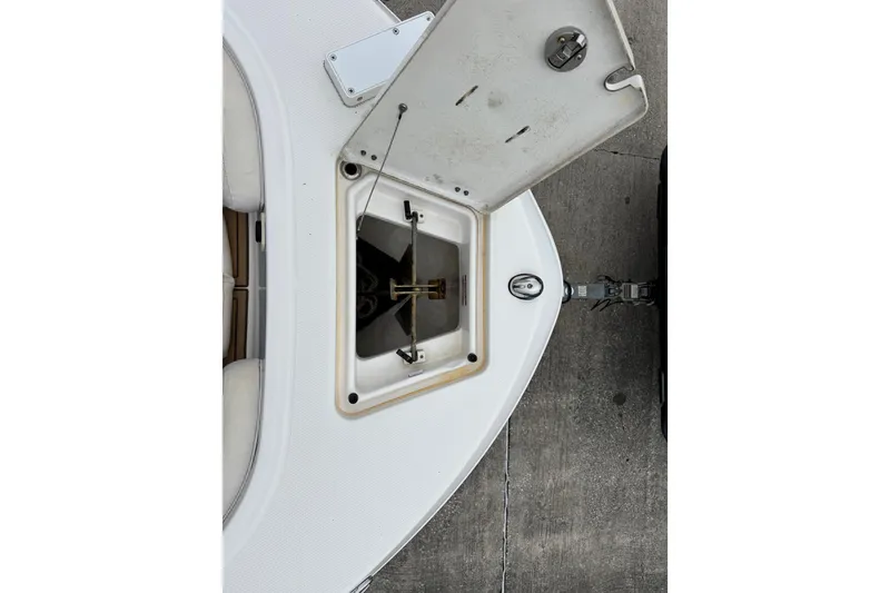 Slide: The Image of Open anchor compartment on 2017 Robalo R200 Center Console boat, showing storage details. - 16