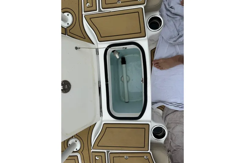 Slide: The Image of 2017 Robalo R200 Center Console boat interior with open storage compartment. - 20