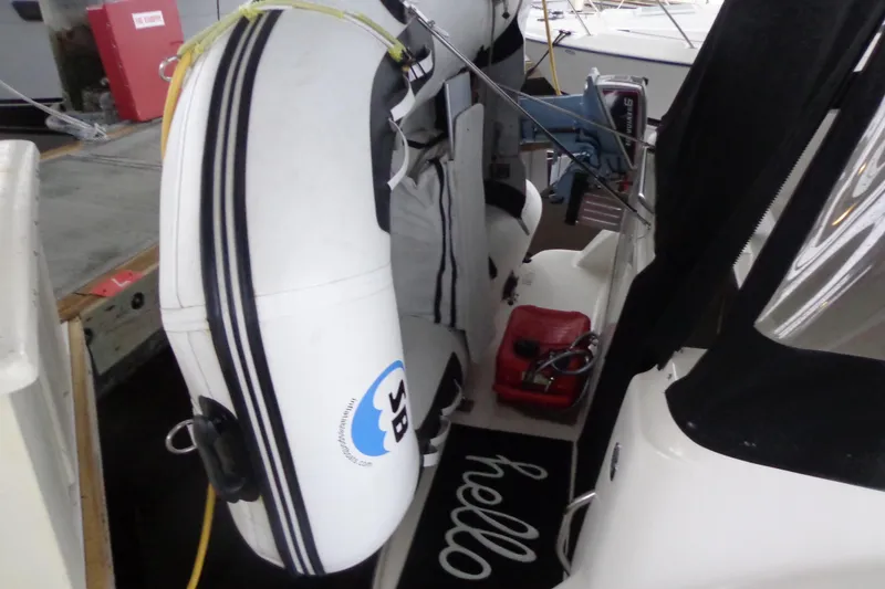 Slide: The Image of 2007 Bayliner 285 with inflatable dinghy and outboard motor on deck. - 10