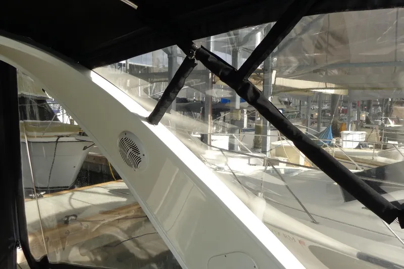 Slide: The Image of Interior view of a 2007 Bayliner 285 boat with marina background. - 19