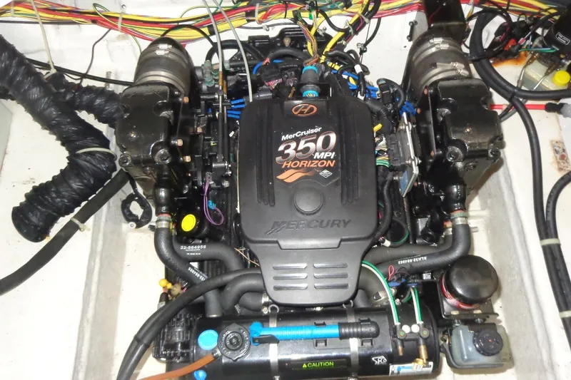 Slide: The Image of Engine of a 2007 Bayliner 285 boat, featuring a MerCruiser 350 MPI Horizon. - 48
