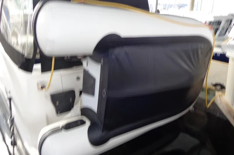Slide: The Image of 2007 Bayliner 285 boat with inflatable dinghy attached at the stern. - 52