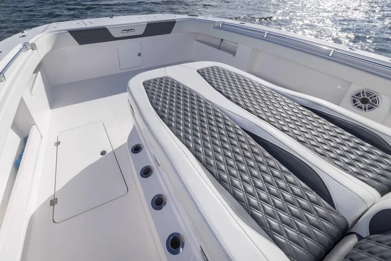 Slide: The Image of 2023 Invincible 35 Catamaran with luxurious diamond-stitched seating and sleek deck design. - 16