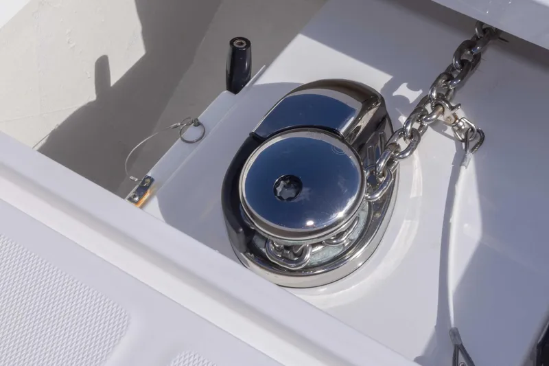 Slide: The Image of Anchor windlass on 2023 Invincible 35 Catamaran, showcasing marine hardware. - 18