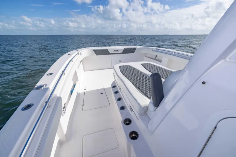 Slide: The Image of 2023 Invincible 35 Catamaran on open water, showcasing spacious deck and seating. - 24