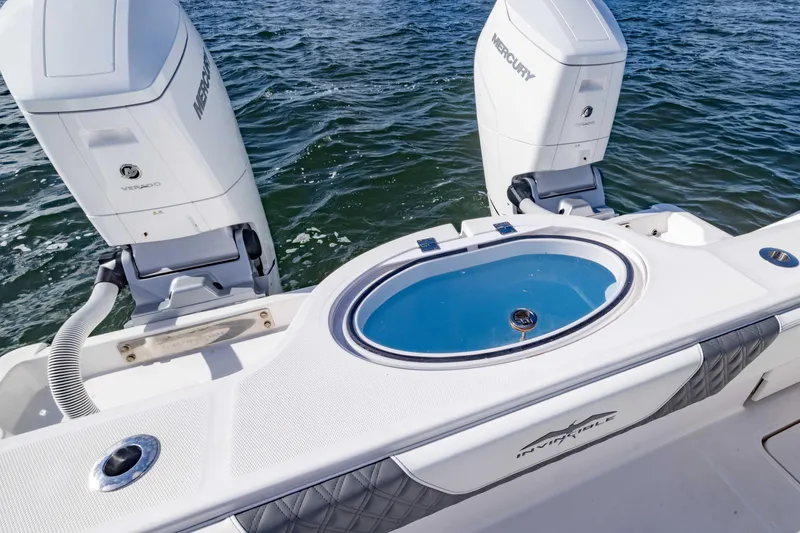 Slide: The Image of 2023 Invincible 35 Catamaran with dual Mercury engines and livewell on open water. - 36
