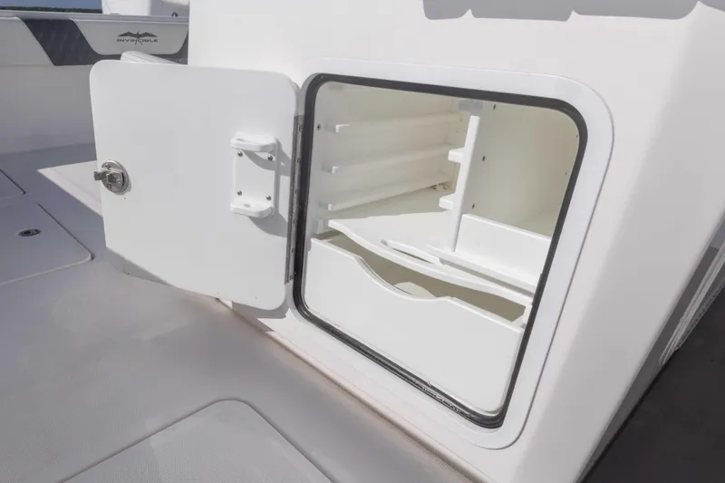 Slide: The Image of Open storage compartment on 2023 Invincible 35 Catamaran boat interior. - 40