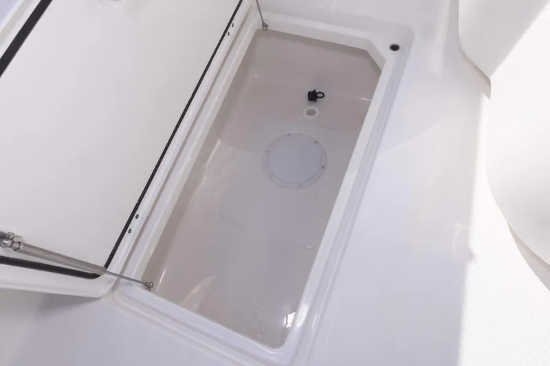 Slide: The Image of Open storage compartment on 2023 Invincible 35 Catamaran boat. - 41