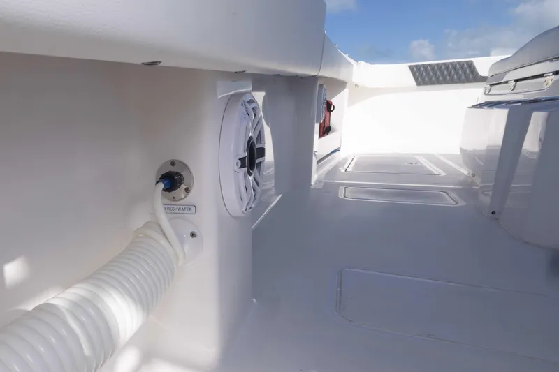 Slide: The Image of 2023 Invincible 35 Catamaran deck with freshwater hose and speaker. - 42