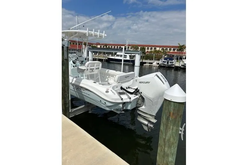 Slide: The Image of 2021 Glasstream 240 CCX boat docked with Mercury engine. - 12