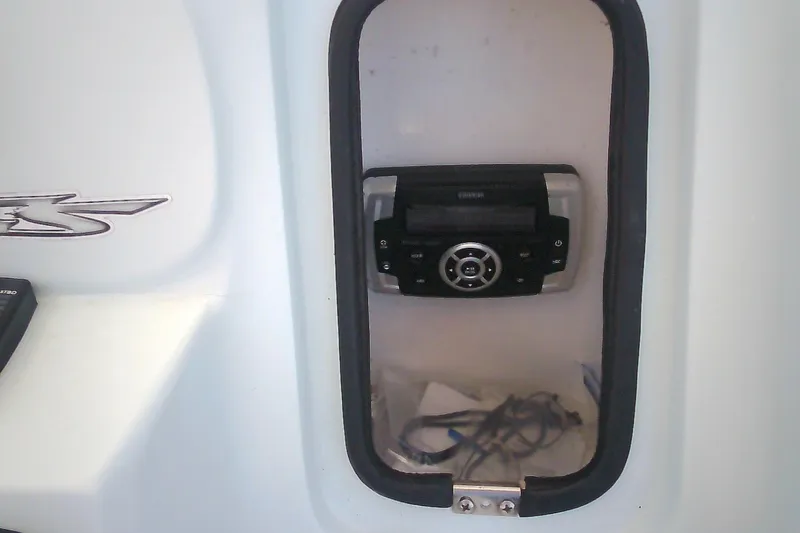 Slide: The Image of 2021 Glasstream 240 CCX boat dashboard with stereo system. - 15