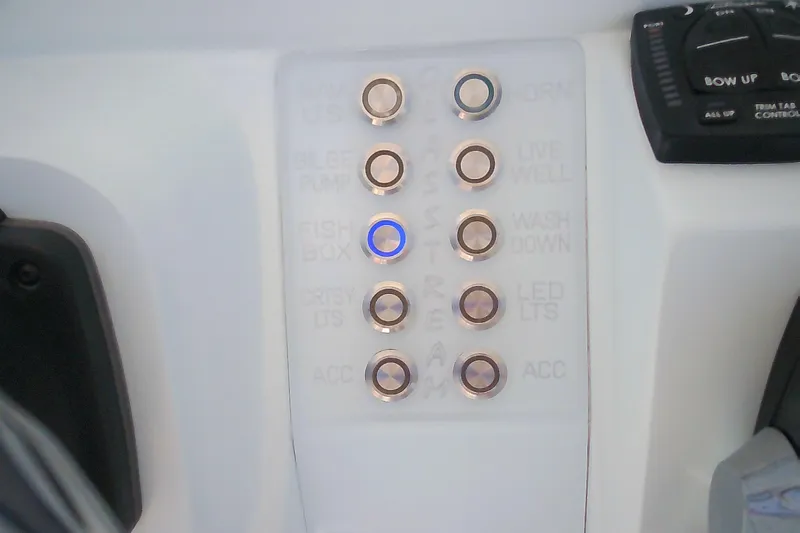 Slide: The Image of Control panel of 2021 Glasstream 240 CCX boat with labeled buttons and switches. - 20