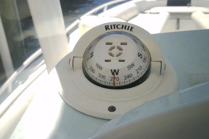 Slide: The Image of Compass on 2021 Glasstream 240 CCX boat dashboard, showing west direction. - 23