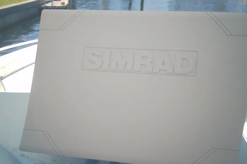 Slide: The Image of Simrad navigation system on 2021 Glasstream 240 CCX boat, dockside view. - 27