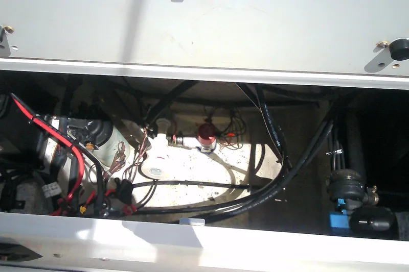 Slide: The Image of 2021 Glasstream 240 CCX engine compartment with wiring and components visible. - 41