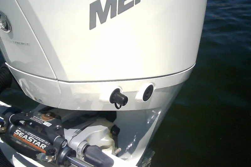 Slide: The Image of Close-up of a 2021 Glasstream 240 CCX boat engine with SeaStar hydraulic steering. - 51