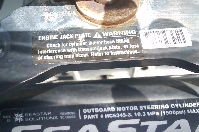 Slide: The Image of Warning label on Glasstream 240 CCX engine jack plate, 2021 model. - 52