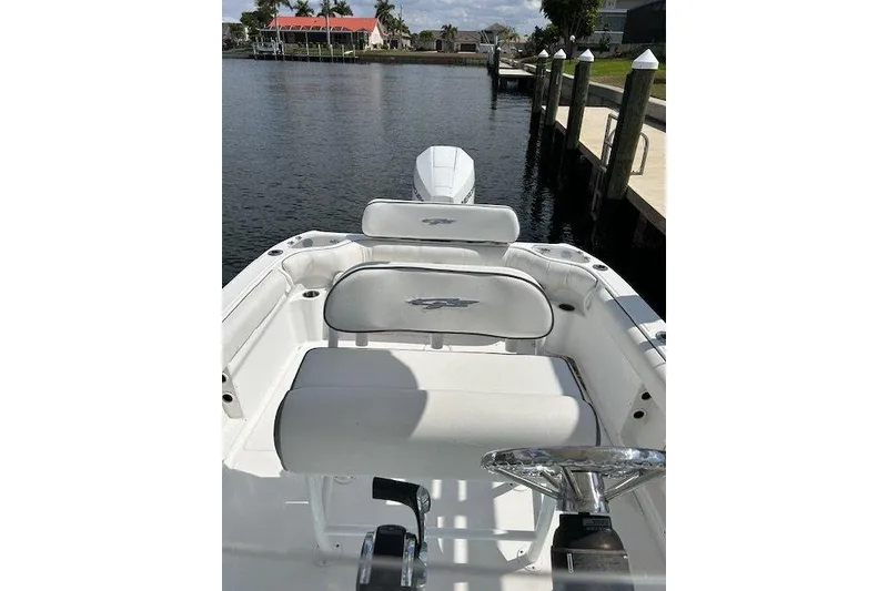 Slide: The Image of 2021 Glasstream 240 CCX boat docked by the water on a sunny day. - 6